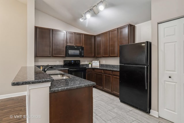 kitchen with lofted ceiling, black appliances, kitchen peninsula, sink, and dark brown cabinetry