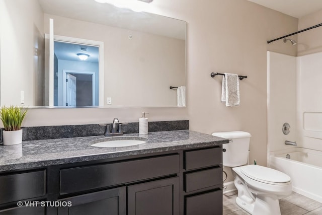 full bathroom with bathing tub / shower combination, tile patterned floors, vanity, and toilet