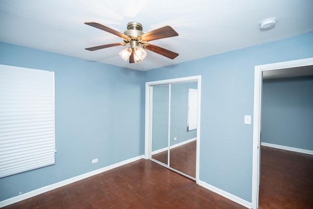 unfurnished bedroom with a closet and ceiling fan