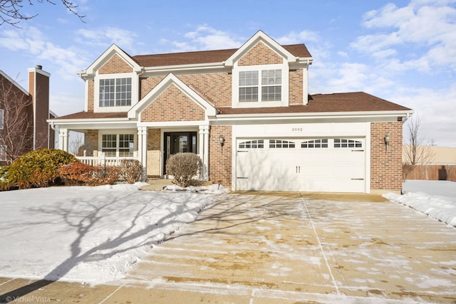 view of front of home with a garage and a porch