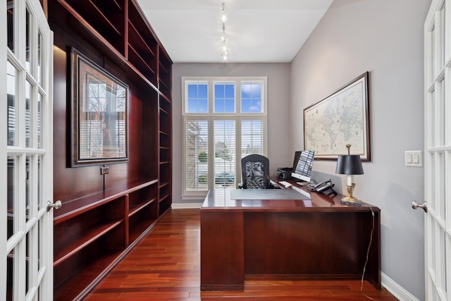 unfurnished office with dark wood-type flooring and french doors