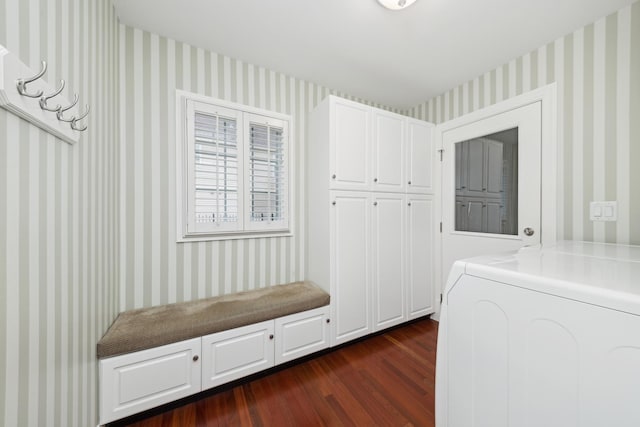 interior space with dark wood-type flooring and washer / dryer