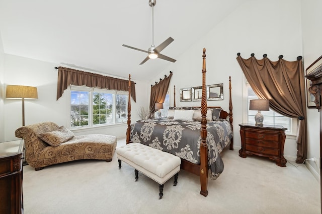 bedroom with multiple windows, ceiling fan, light carpet, and high vaulted ceiling