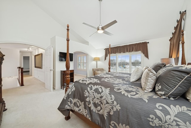 carpeted bedroom featuring ceiling fan and high vaulted ceiling