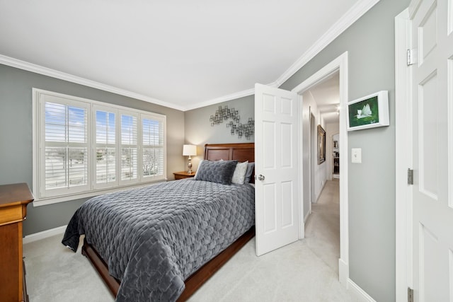 carpeted bedroom featuring crown molding