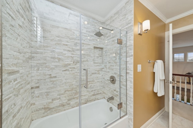 bathroom with ornamental molding and combined bath / shower with glass door