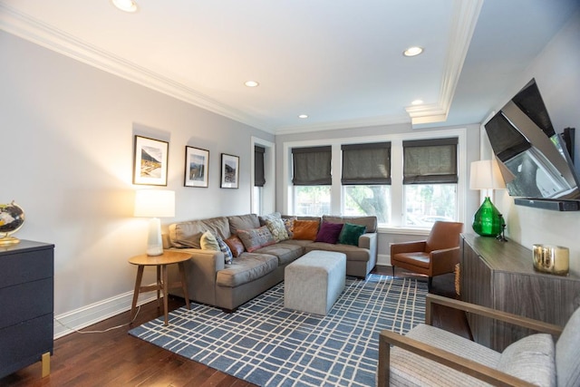 living room featuring dark wood-type flooring and ornamental molding