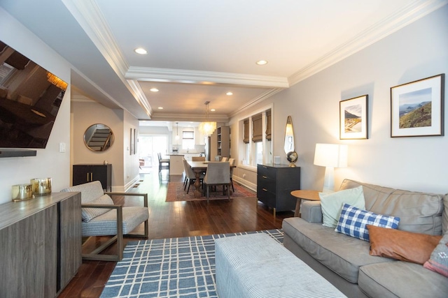 living room featuring dark hardwood / wood-style flooring and crown molding