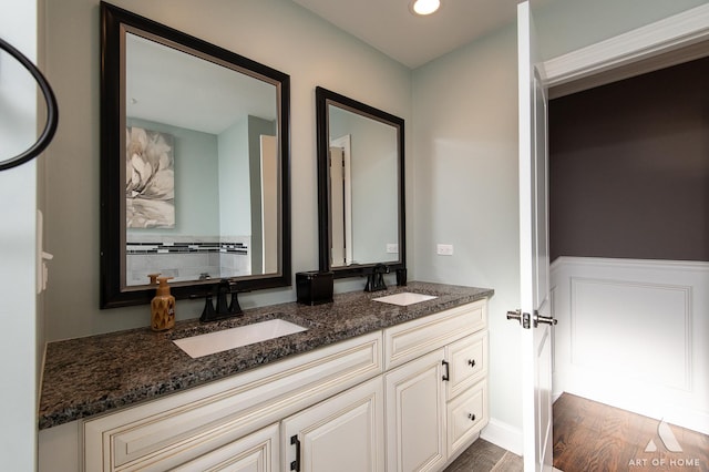 bathroom with vanity and hardwood / wood-style flooring