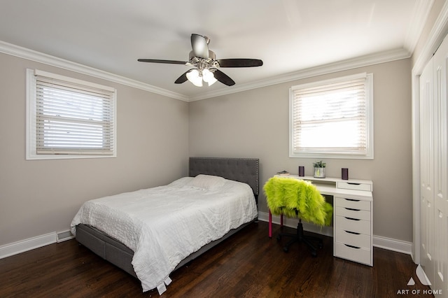 bedroom featuring multiple windows, ceiling fan, a closet, and dark wood-type flooring