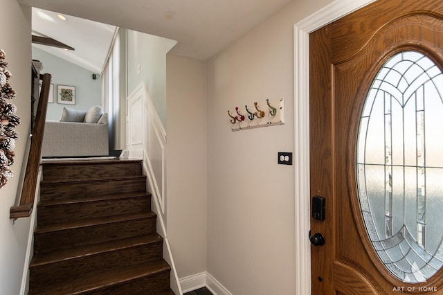 entrance foyer featuring vaulted ceiling