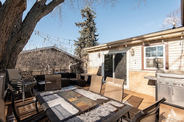 deck featuring an outdoor living space and area for grilling