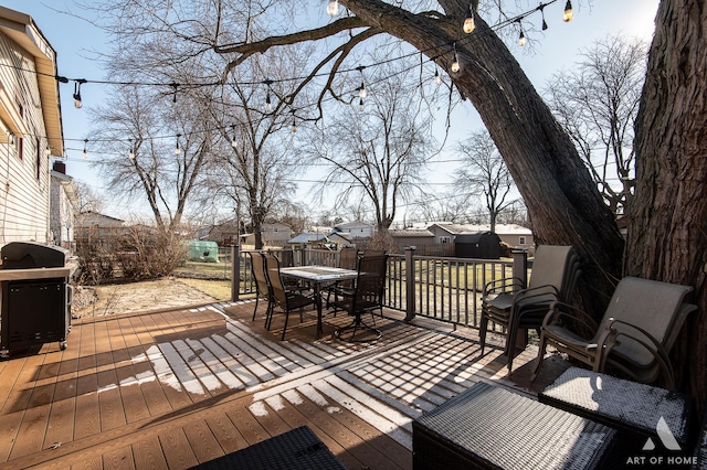 wooden terrace with a grill