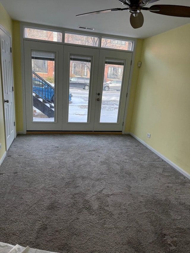 spare room with french doors and carpet