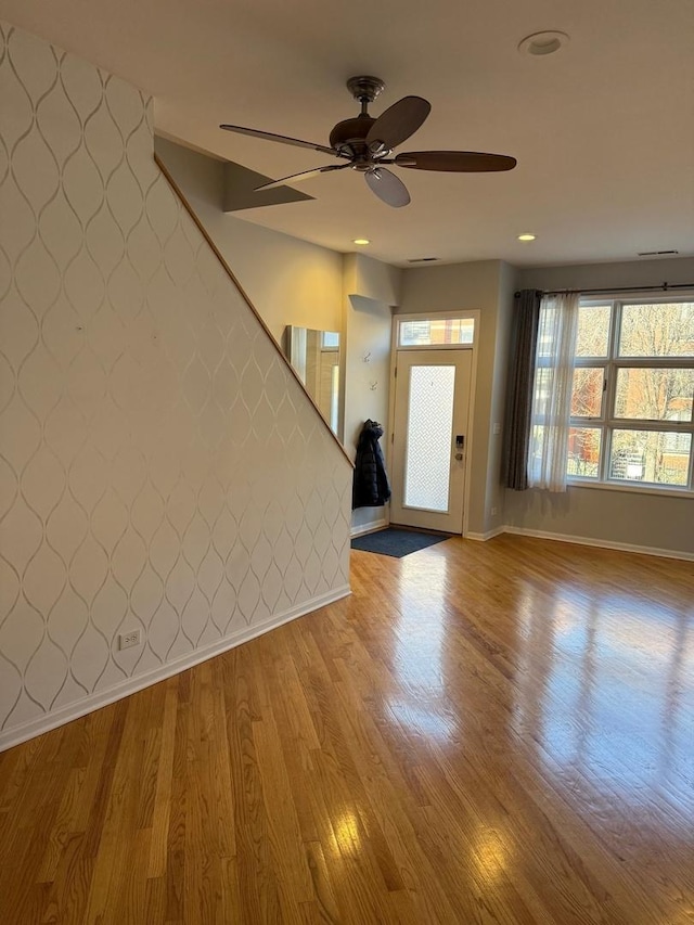 entryway with hardwood / wood-style flooring and ceiling fan