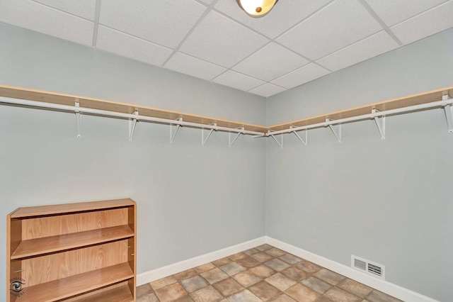 walk in closet featuring a drop ceiling