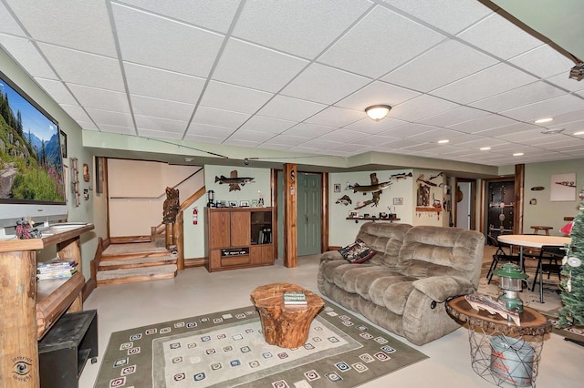 living room featuring a paneled ceiling