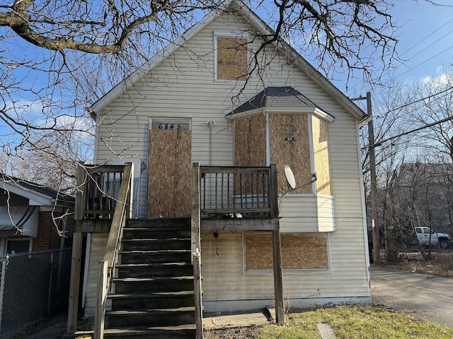 back of house with a balcony