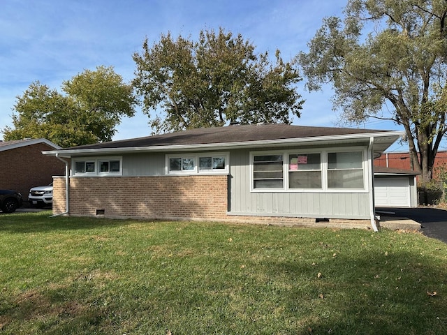 view of front of property with a garage and a front yard