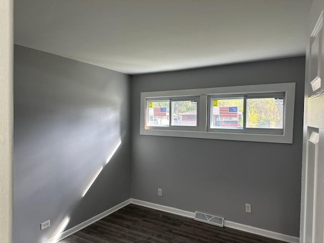 empty room featuring dark hardwood / wood-style floors