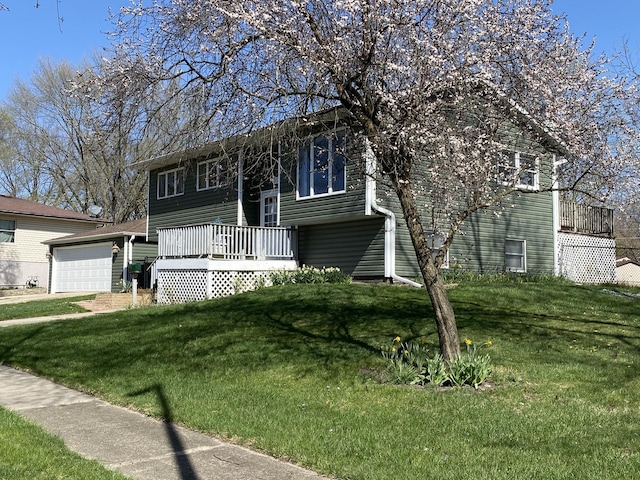 raised ranch featuring a wooden deck and a front lawn