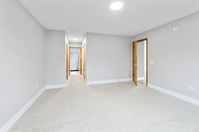 empty room featuring light colored carpet