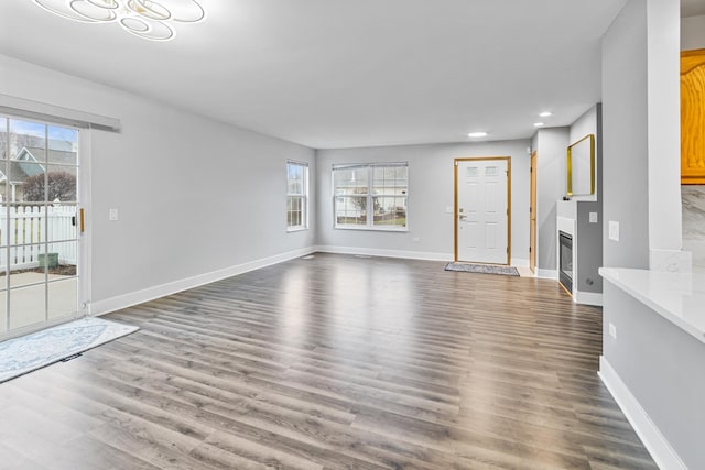 unfurnished living room featuring hardwood / wood-style floors