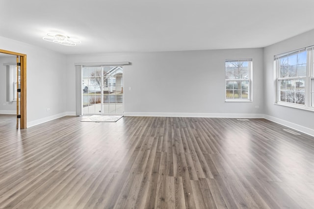 empty room with hardwood / wood-style flooring