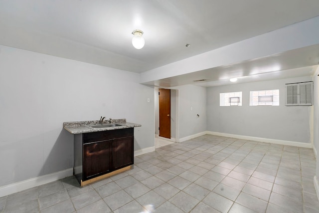 interior space featuring sink and light tile patterned floors