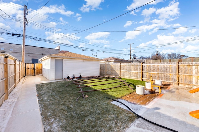 view of yard with an outdoor structure and a patio