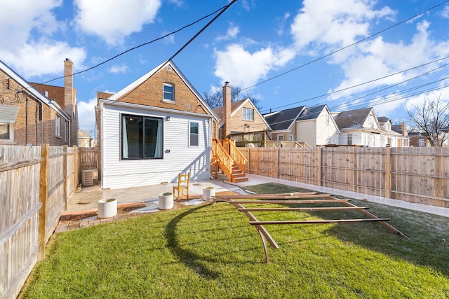 back of property featuring cooling unit and a lawn