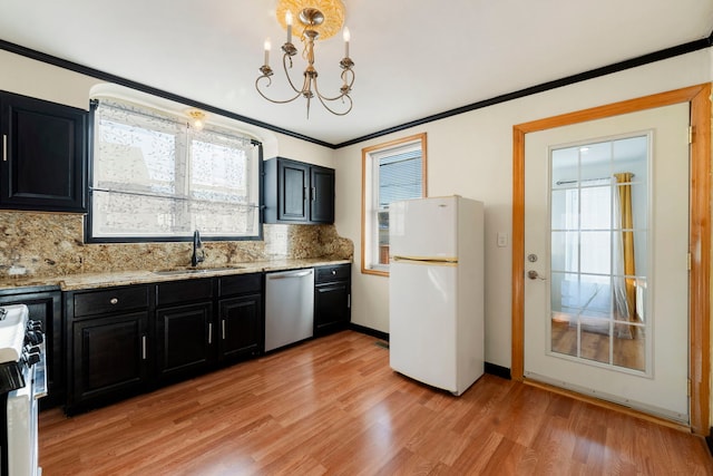 kitchen with sink, range, white refrigerator, ornamental molding, and dishwasher