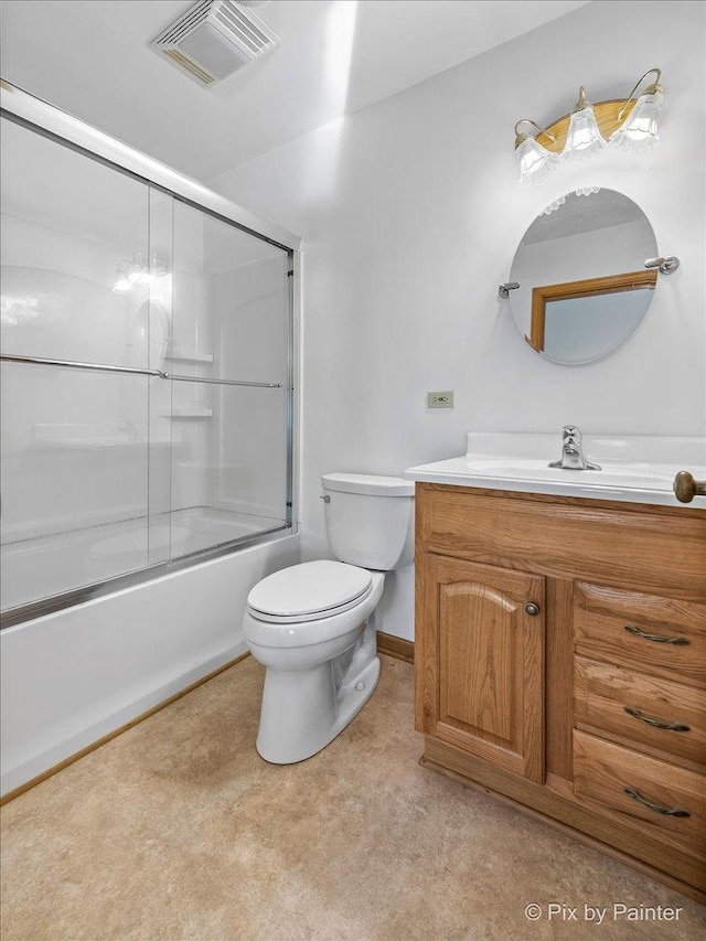 full bathroom featuring vanity, toilet, and bath / shower combo with glass door