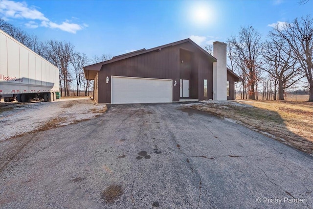 view of property exterior featuring a garage