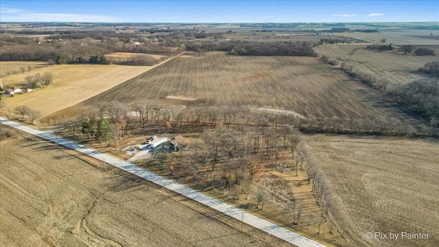 birds eye view of property with a rural view