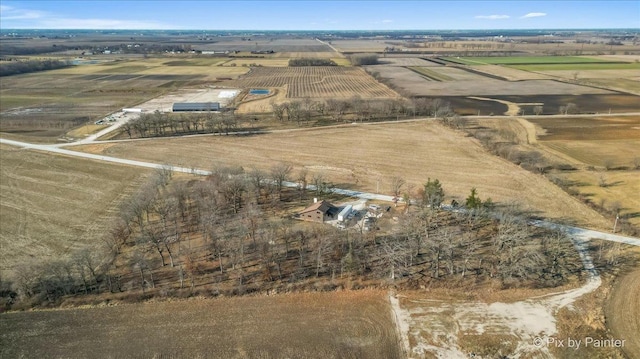 birds eye view of property with a rural view