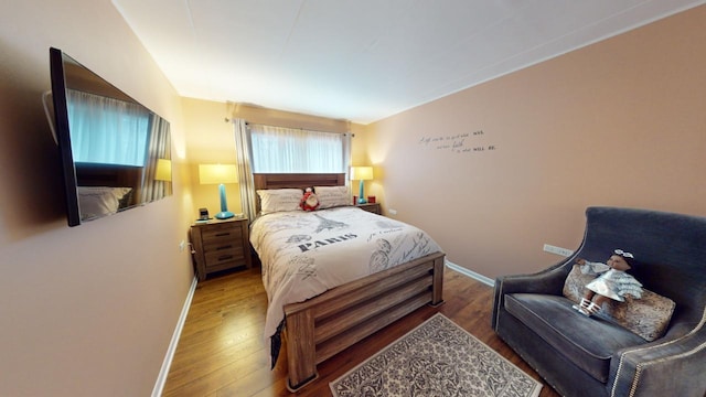 bedroom with wood-type flooring