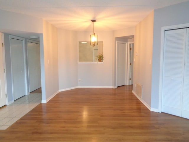 spare room featuring hardwood / wood-style floors