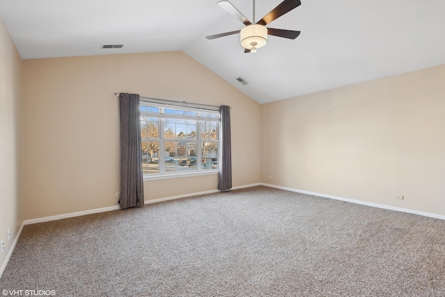 unfurnished room with ceiling fan, carpet floors, and lofted ceiling