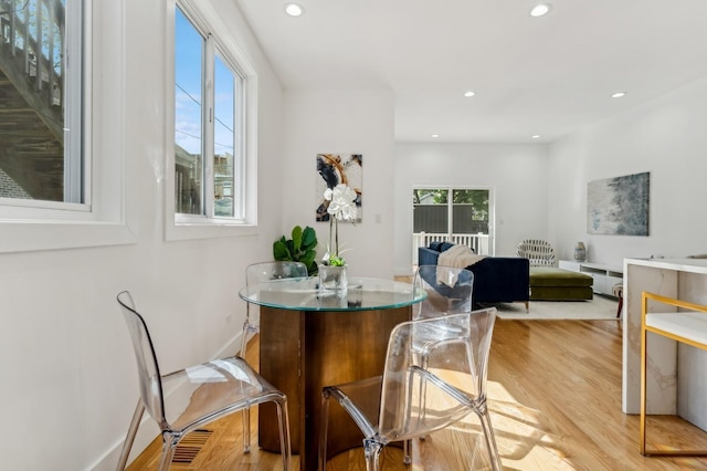 dining room with light hardwood / wood-style flooring