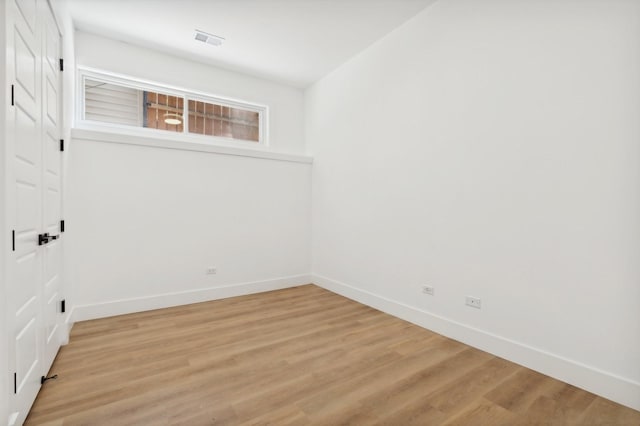 spare room with light hardwood / wood-style floors