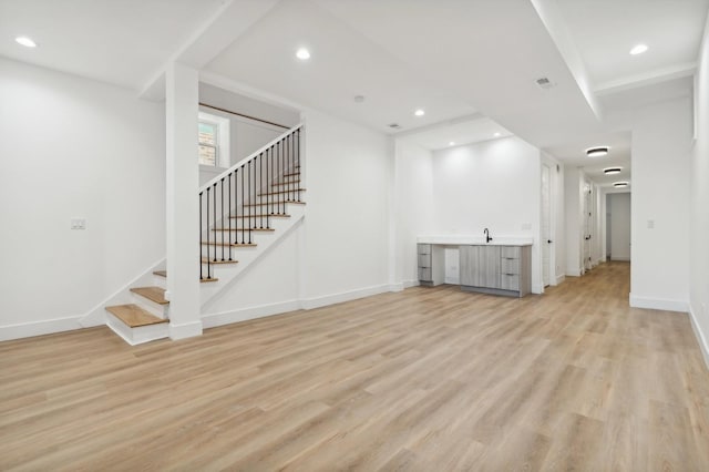 unfurnished living room featuring light wood-type flooring