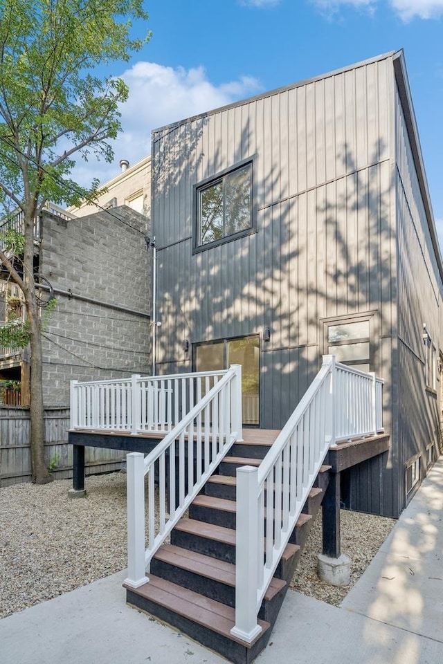 view of side of property with a wooden deck