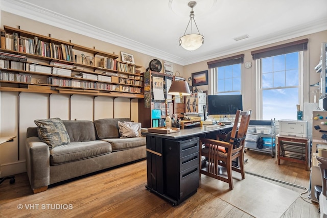 home office with wood-type flooring and ornamental molding