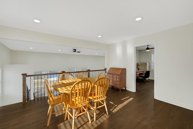 dining room with ceiling fan and dark wood-type flooring