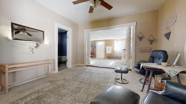 living area featuring ceiling fan