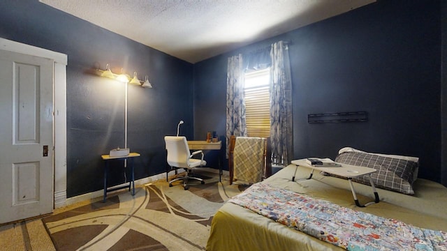 bedroom featuring a textured ceiling