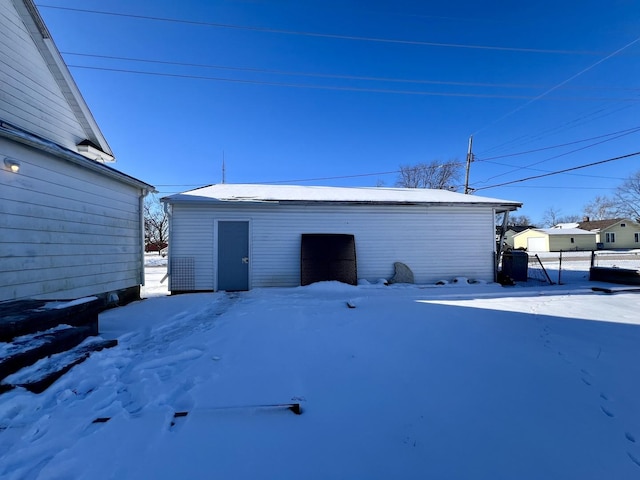 view of snow covered garage