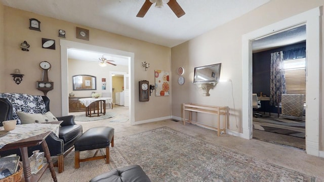 living area featuring ceiling fan