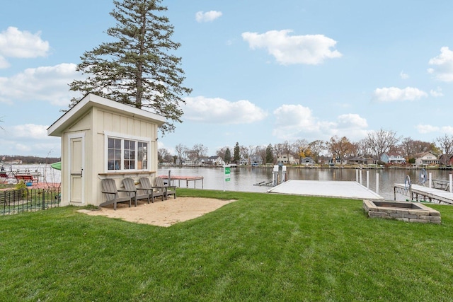 dock area featuring a yard and a water view